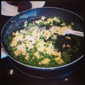 Scramble the eggs to the side and then mix with veggies.